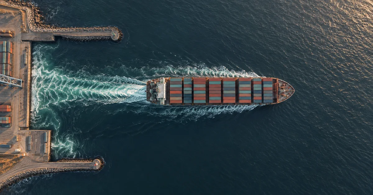 Unmarked container ship leaving a Baltic port for open sea